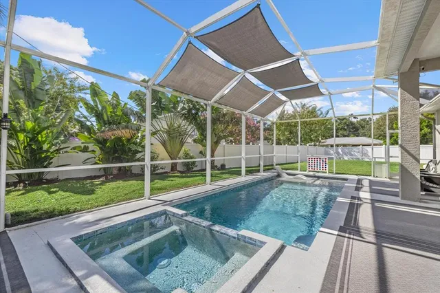 a view of outdoor space with swimming pool and furniture