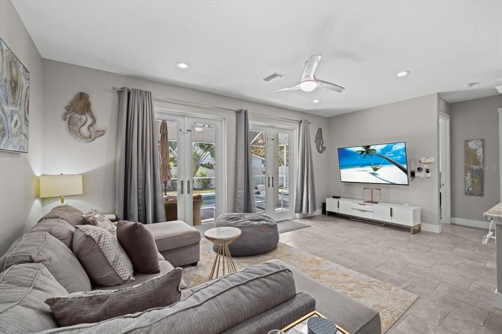 279 Avalon Road Venice, FL 34293 - Photo 13 of 32 a living room with furniture and a flat screen tv
