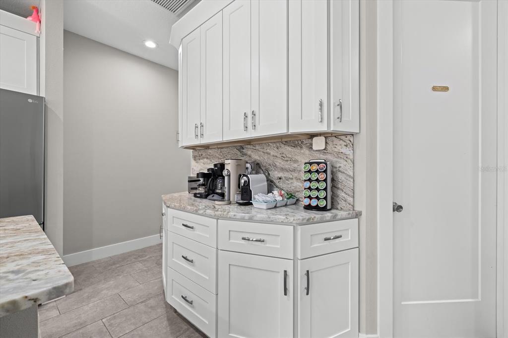 279 Avalon Road Venice, FL 34293 - Photo 20 of 32 a kitchen with cabinets and window