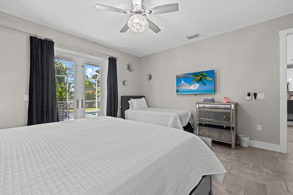 279 Avalon Road Venice, FL 34293 - Photo 23 of 32 a bedroom with a bed and a large window