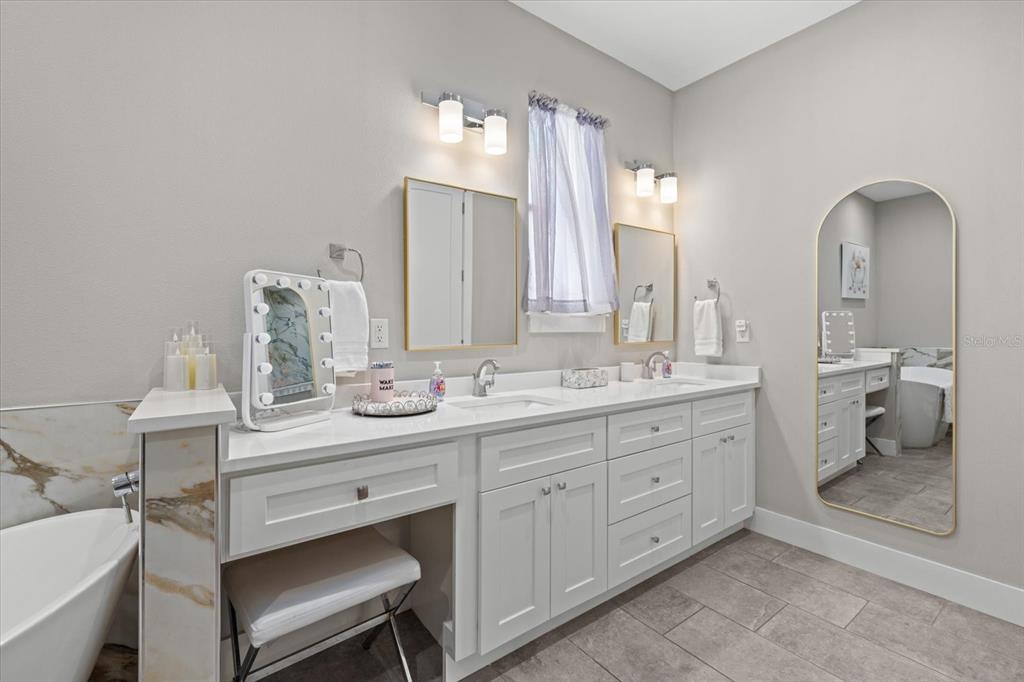 279 Avalon Road Venice, FL 34293 - Photo 27 of 32 a bathroom with a double vanity sink and a toilet