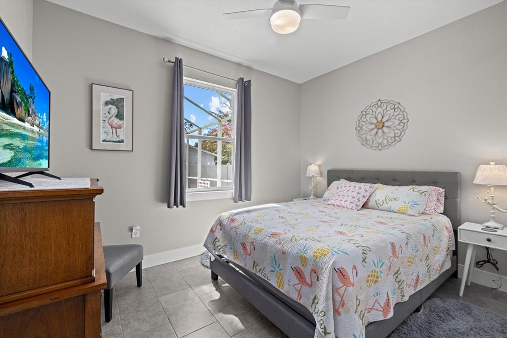 279 Avalon Road Venice, FL 34293 - Photo 29 of 32 a bedroom with a bed and a flat screen tv