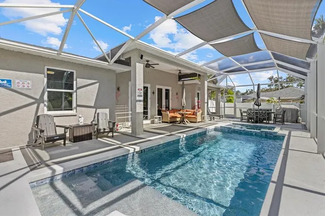 a living room with couch and a dining table