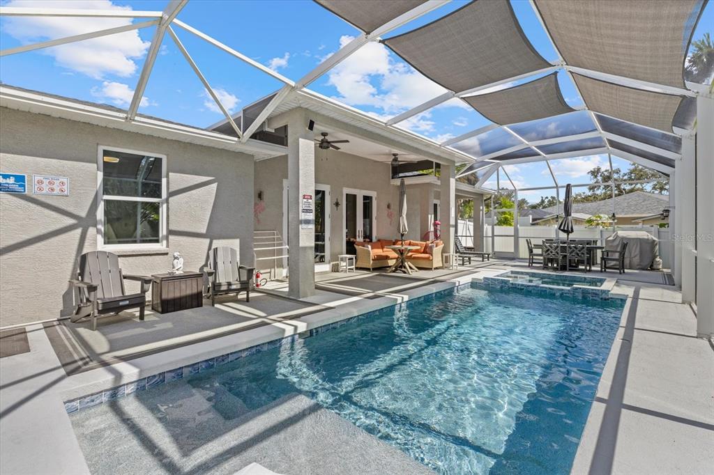 279 Avalon Road Venice, FL 34293 - Photo 6 of 32 a living room with couch and a dining table
