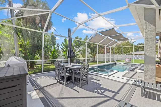 a view of a patio with couches table and chairs