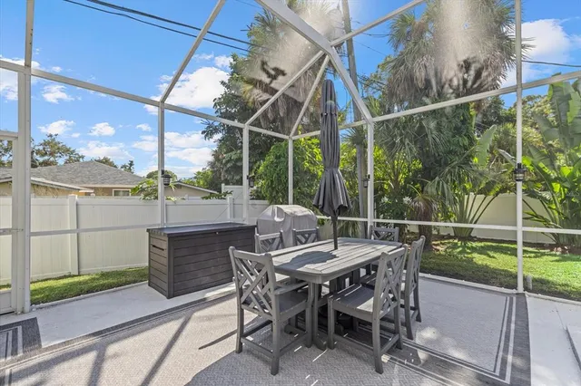 a patio with table and chairs