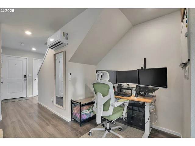 a workspace with furniture and wooden floor