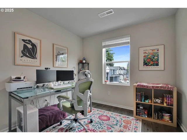 a view of a workspace with furniture