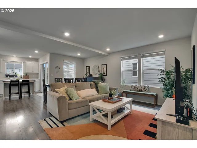 a living room with furniture and a table