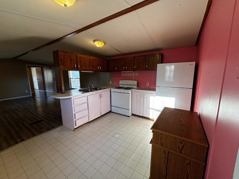 29 Pulaski Street Mahomet, IL 61853 - Photo 9 of 17 a kitchen with stainless steel appliances a refrigerator and microwave