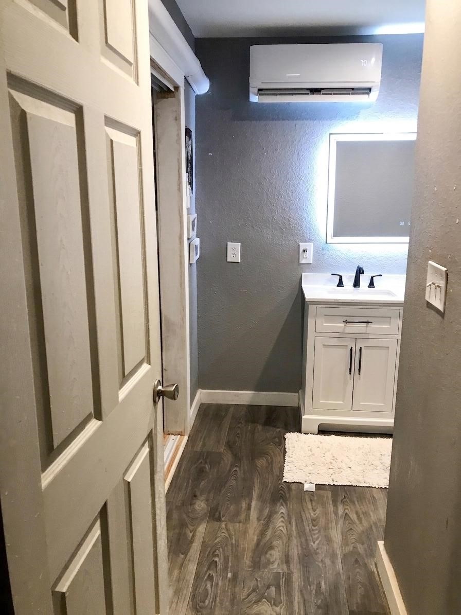 24300 County Road 332 Sweeny, TX 77480 - Photo 14 of 27 a bathroom with a sink a toilet and mirror