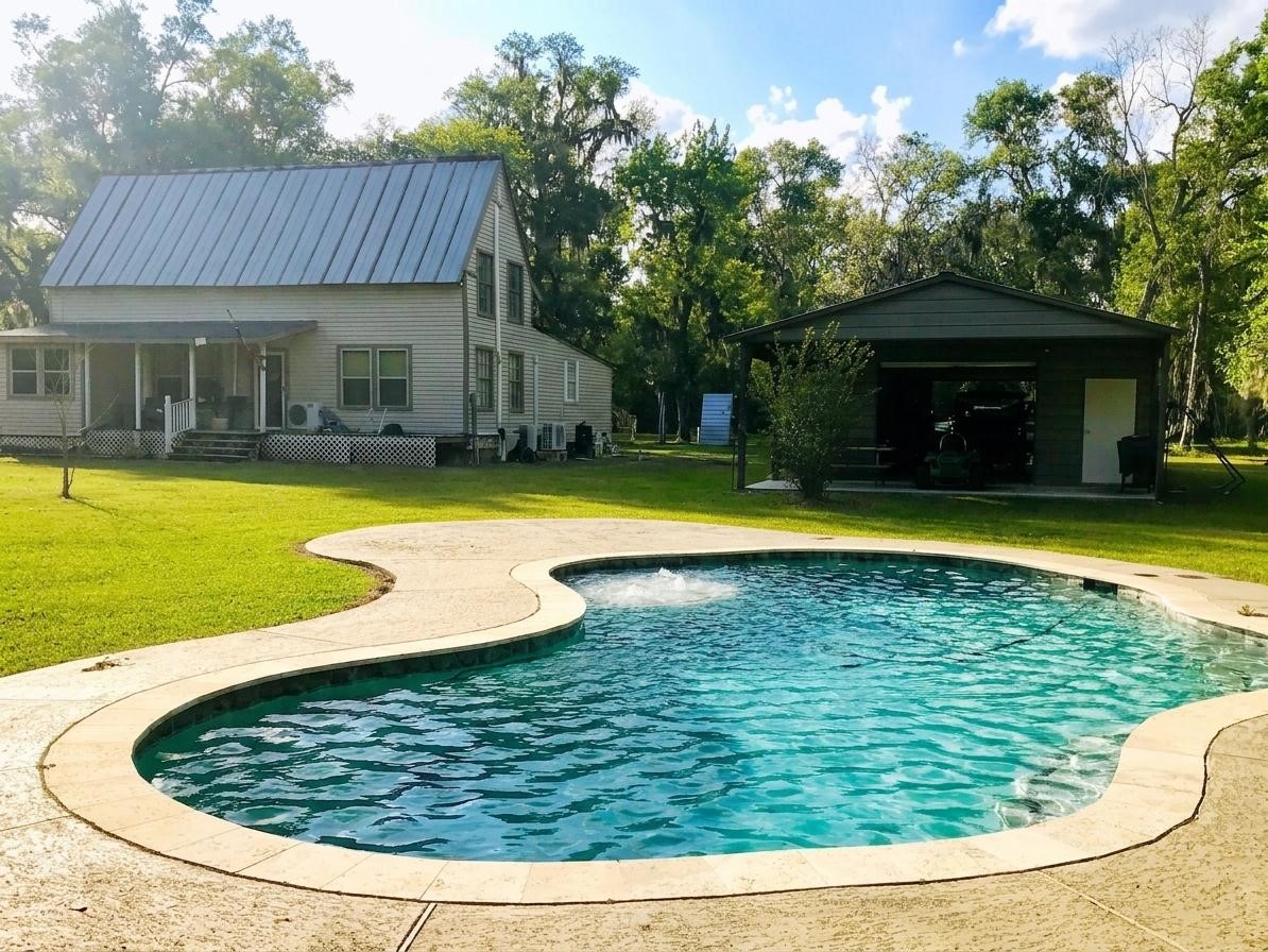 24300 County Road 332 Sweeny, TX 77480 - Photo 4 of 27 a view of swimming pool with seating space