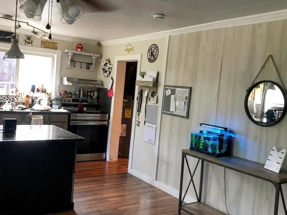 24300 County Road 332 Sweeny, TX 77480 - Photo 10 of 27 a kitchen with stainless steel appliances granite countertop a refrigerator and a sink