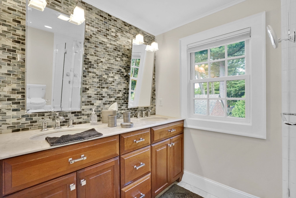 70 Dover Road Longmeadow, MA 01106 - Photo 33 of 37 a bathroom with a sink and a mirror