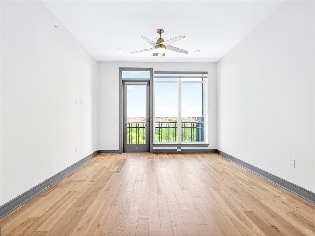 2700 Old Denton Road, Unit 4440 Carrollton, TX 75007 - Photo 14 of 32 Bright interior space featuring wood-finish flooring, a contemporary ceiling fan, and recessed lighting