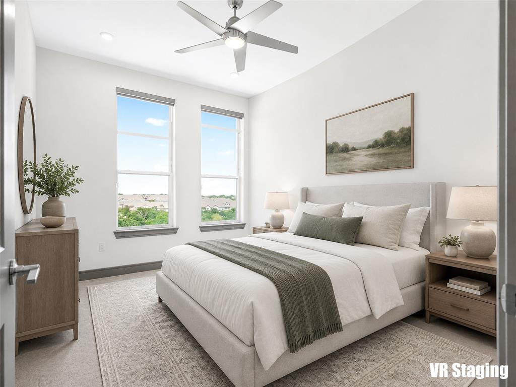 2700 Old Denton Road, Unit 4440 Carrollton, TX 75007 - Photo 18 of 32 Spacious bedroom featuring dual vertical windows, a contemporary ceiling fan with integrated lighting, recessed ceiling lights, and light-toned carpeting