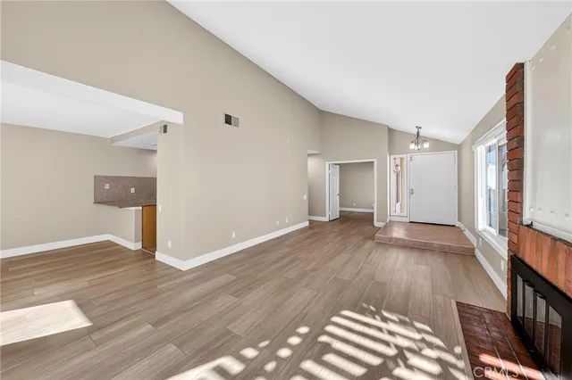 a view of a room with wooden floor and staircase