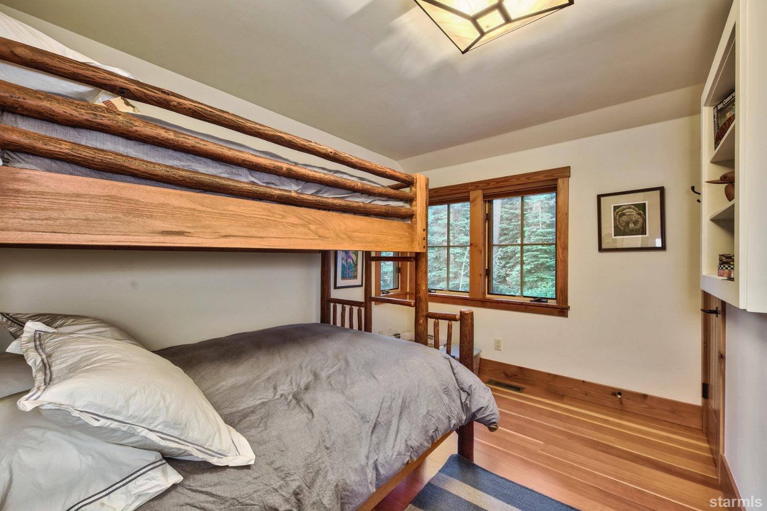 373 Fallen Leaf Road Fallen Leaf, CA 96150 - Photo 16 of 40 a bedroom with a bed and a window