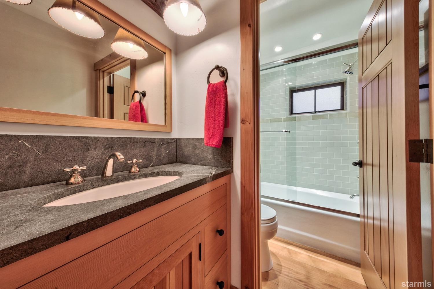 373 Fallen Leaf Road Fallen Leaf, CA 96150 - Photo 17 of 40 a bathroom with a sink and a mirror