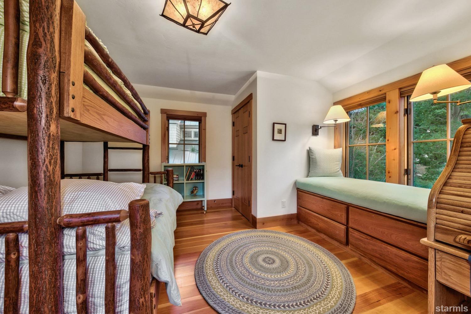 373 Fallen Leaf Road Fallen Leaf, CA 96150 - Photo 18 of 40 a bedroom with furniture and a window