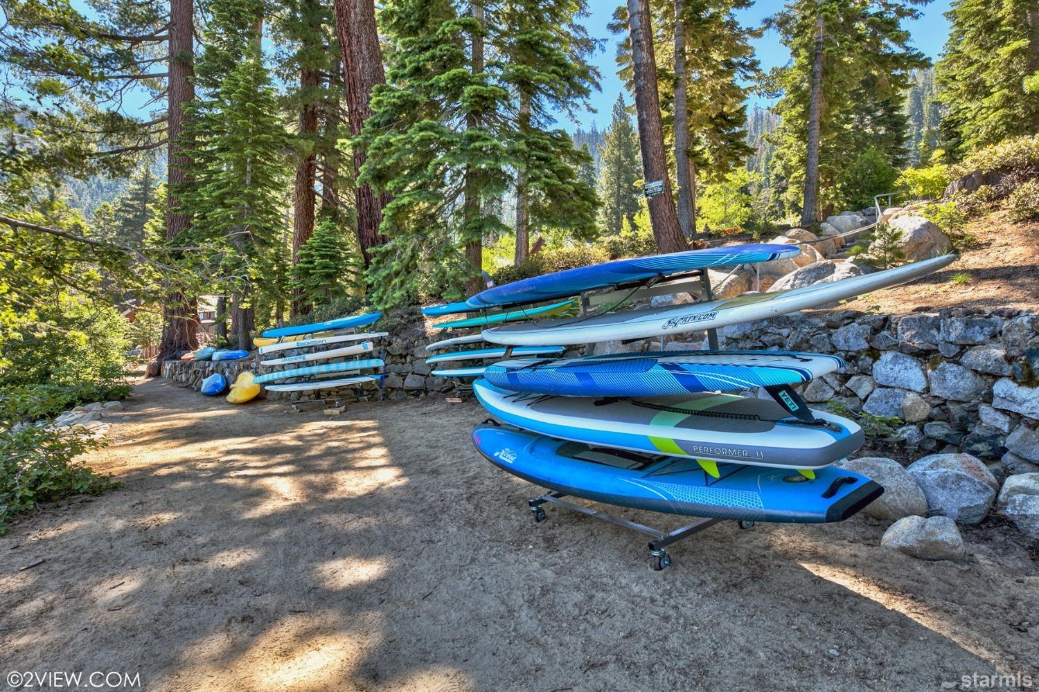 373 Fallen Leaf Road Fallen Leaf, CA 96150 - Photo 34 of 40 a wooden bench sitting in the middle of a yard