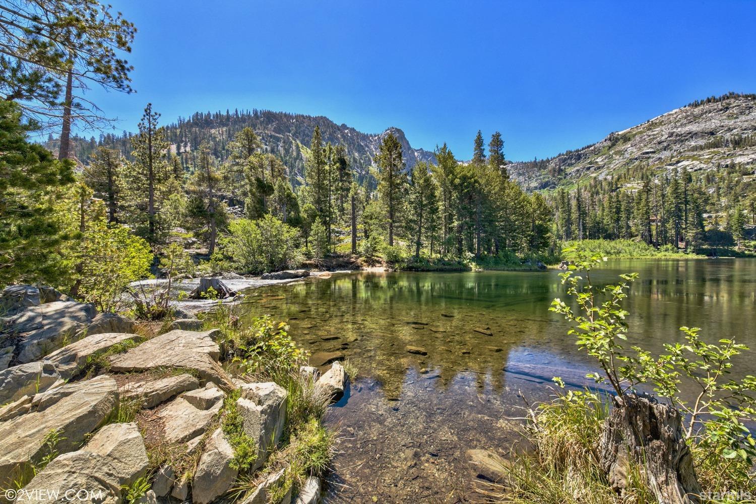 373 Fallen Leaf Road Fallen Leaf, CA 96150 - Photo 37 of 40 a view of a lake with a building in the background