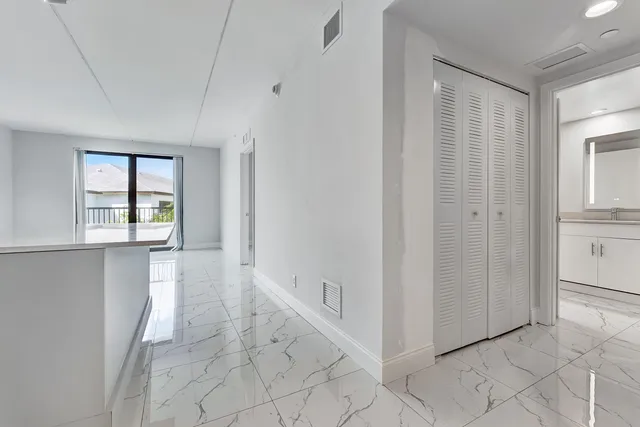 a view of an entryway with white walls