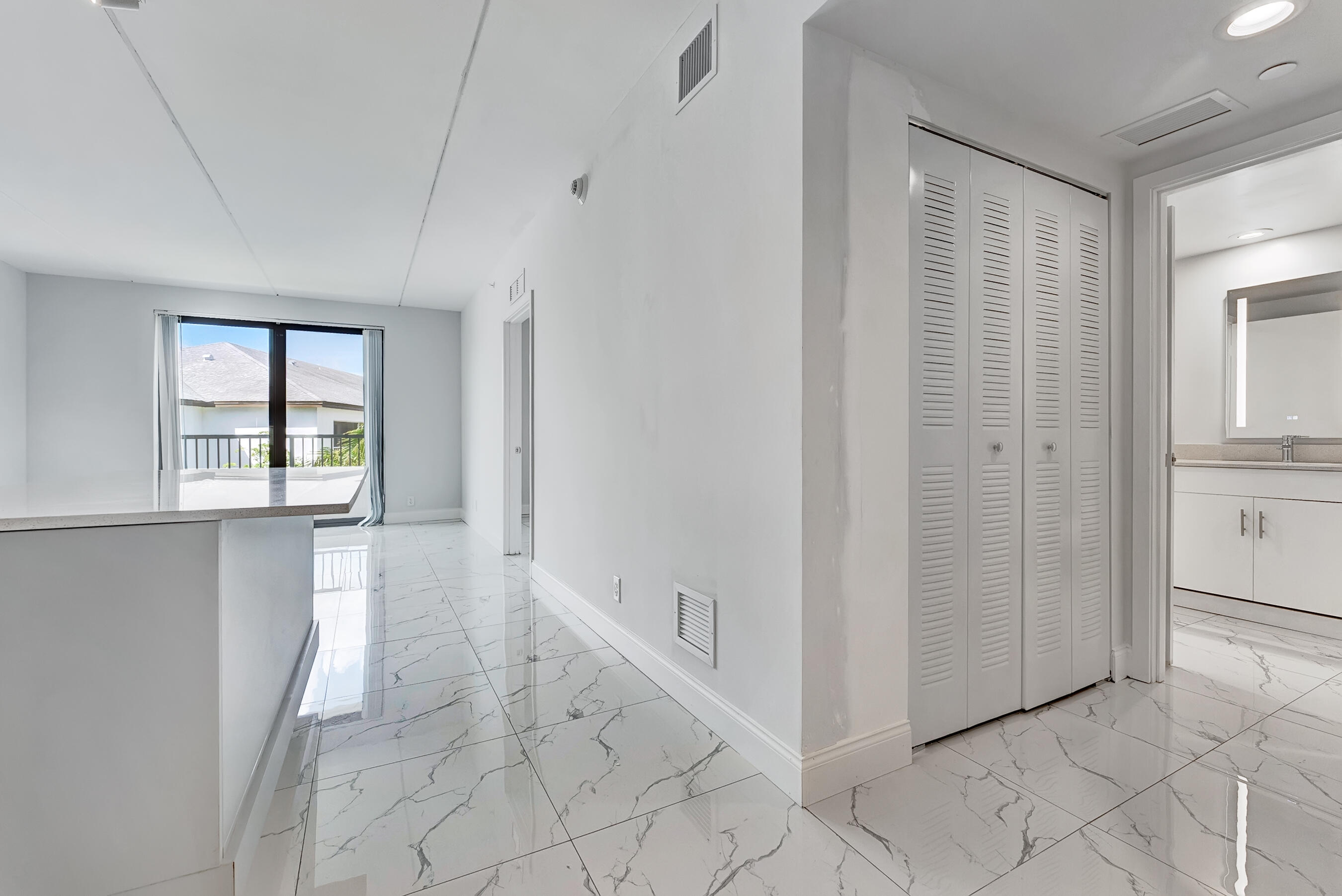 250 West Hidden Valley Boulevard, Unit 2 Boca Raton, FL 33487 - Photo 3 of 19 a view of an entryway with white walls
