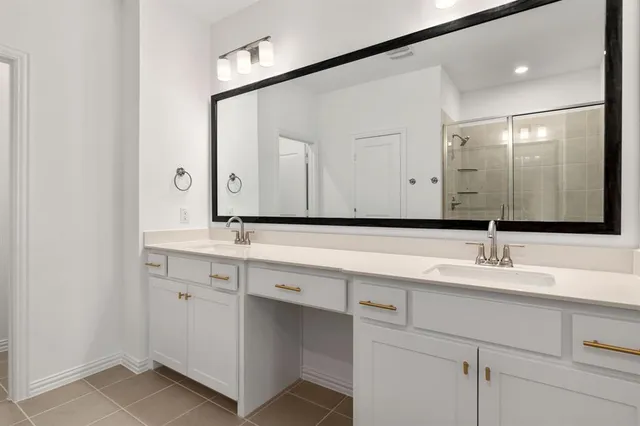 an empty room with chandelier fan