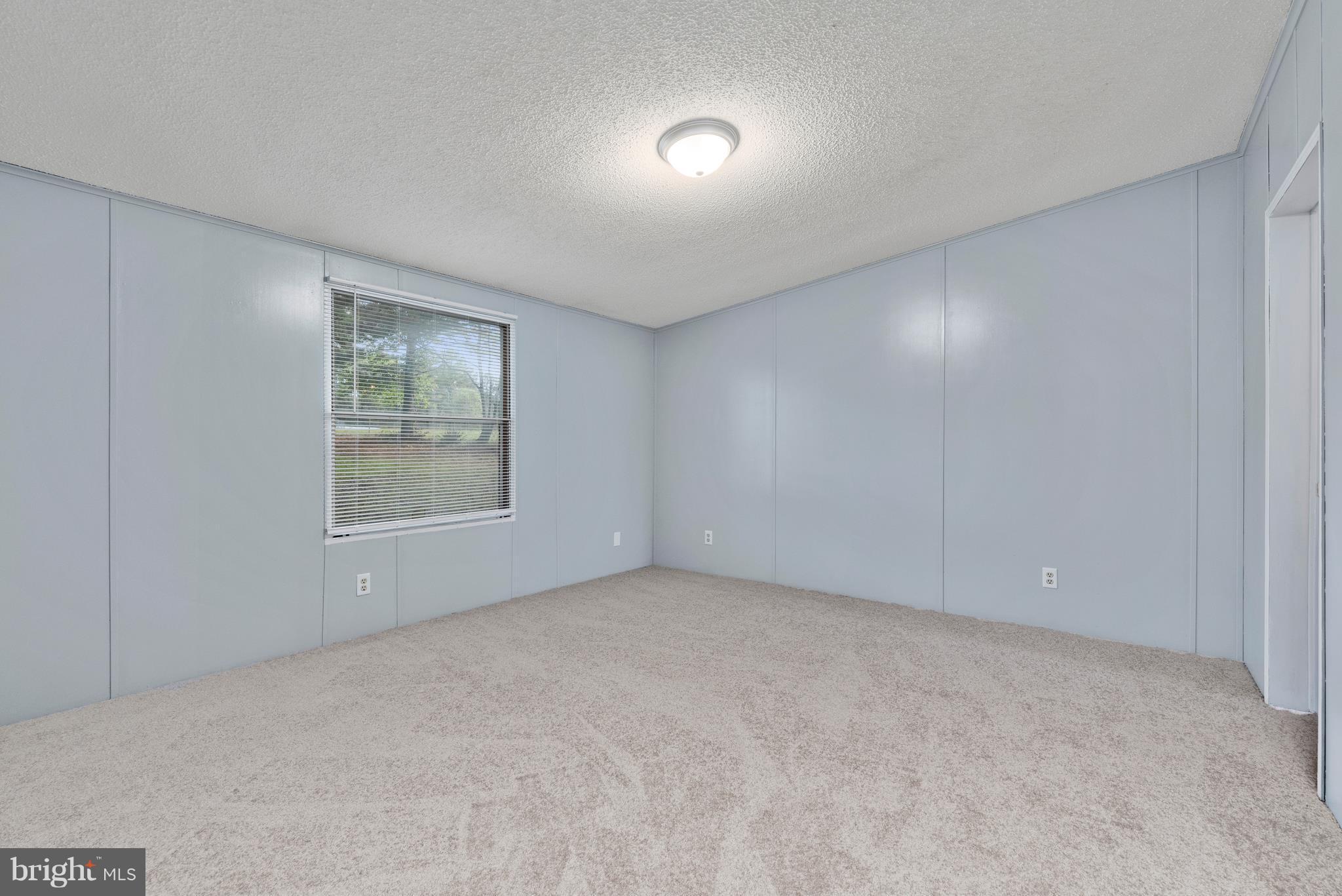 10000 Edenton Road Partlow, VA 22534 - Photo 11 of 30 an empty room with windows and closet