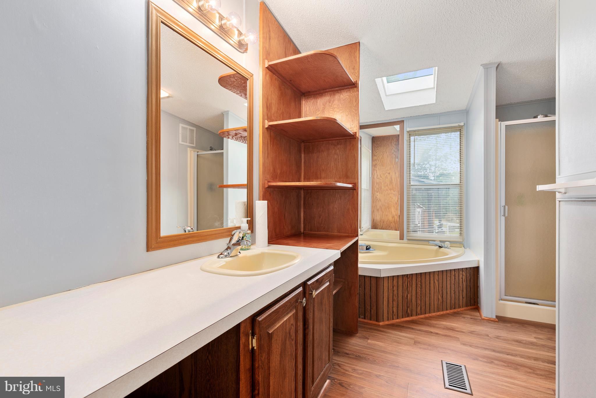 10000 Edenton Road Partlow, VA 22534 - Photo 12 of 30 a bathroom with a double vanity sink and a mirror