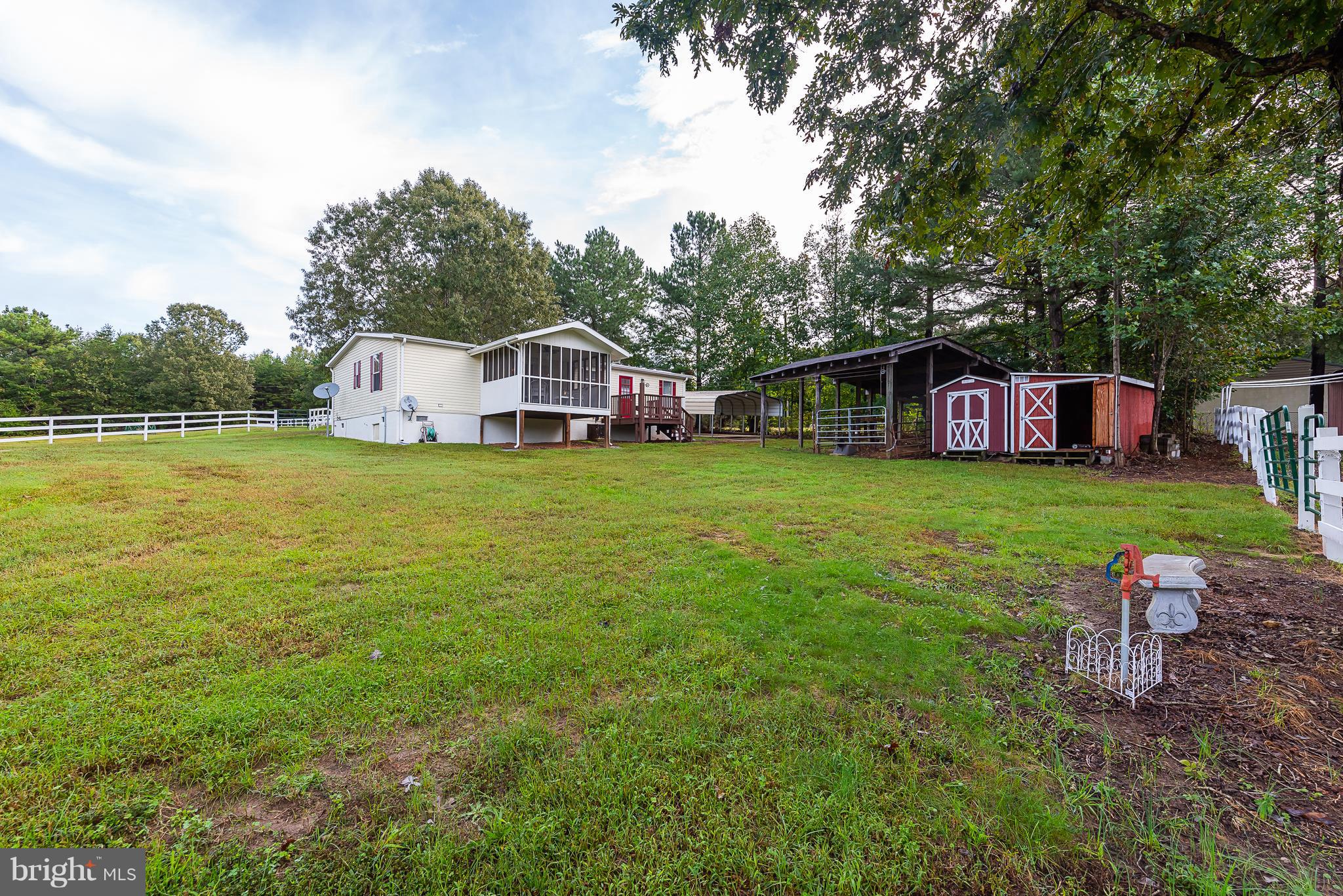 10000 Edenton Road Partlow, VA 22534 - Photo 25 of 30 a view of a house with a yard and sitting area
