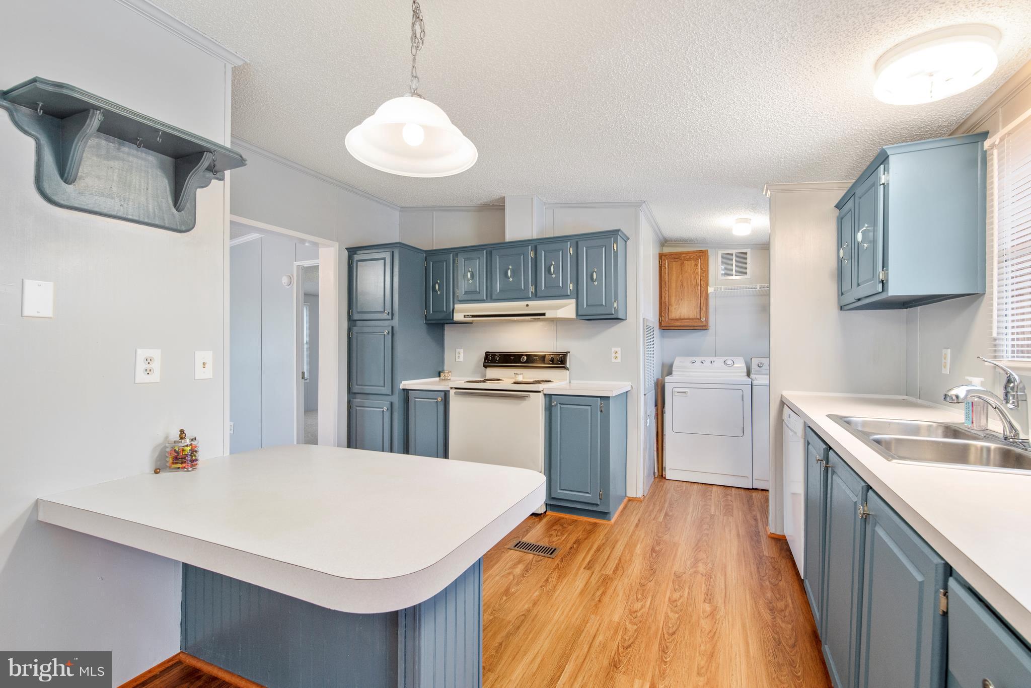 10000 Edenton Road Partlow, VA 22534 - Photo 8 of 30 a kitchen with a sink a stove and refrigerator