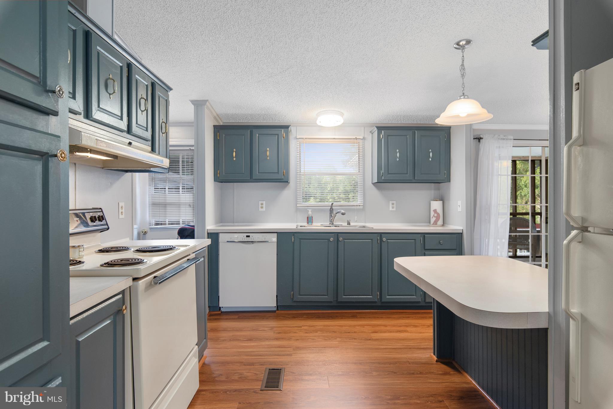 10000 Edenton Road Partlow, VA 22534 - Photo 9 of 30 a kitchen with stainless steel appliances granite countertop a sink a stove a refrigerator cabinets and chairs