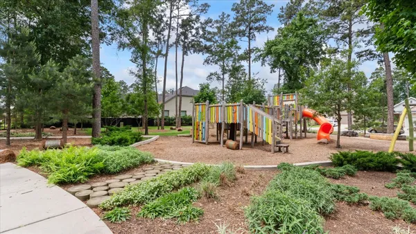 a view of a park with swings and slides