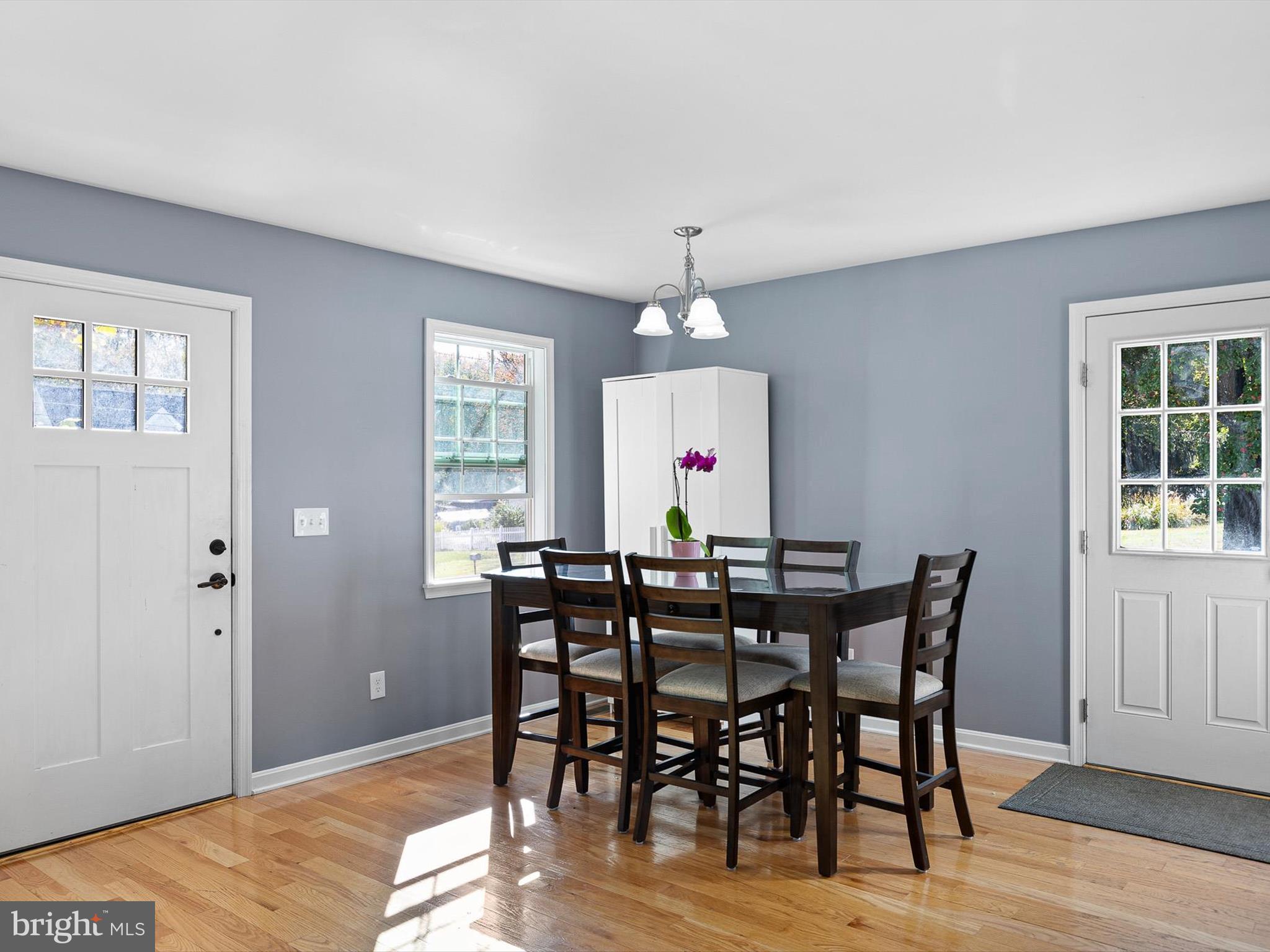 653 Mechanics Valley Road North East, MD 21901 - Photo 11 of 21 a view of a dining room with furniture and wooden floor