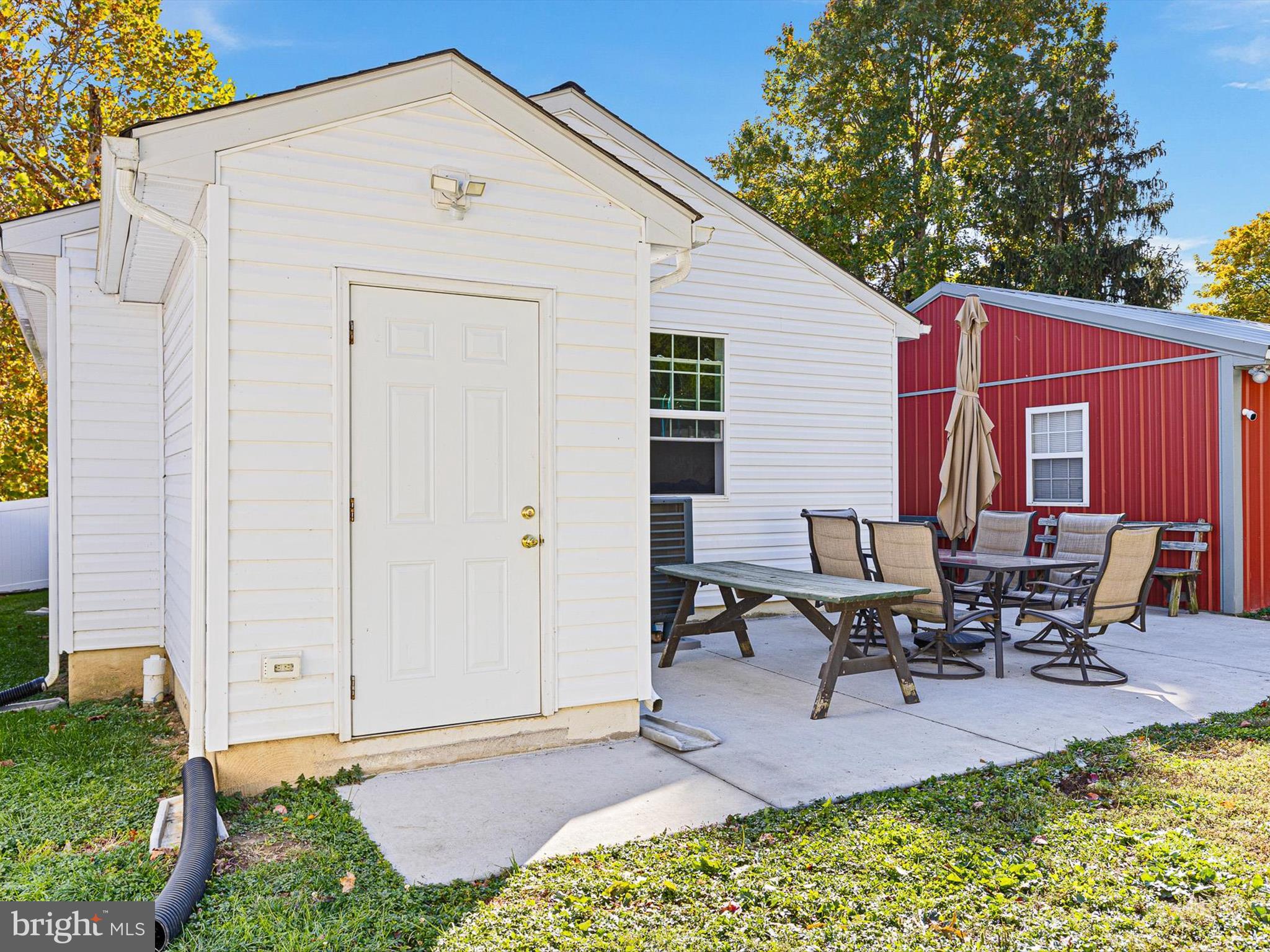 653 Mechanics Valley Road North East, MD 21901 - Photo 2 of 21 a backyard of a house with table and chairs