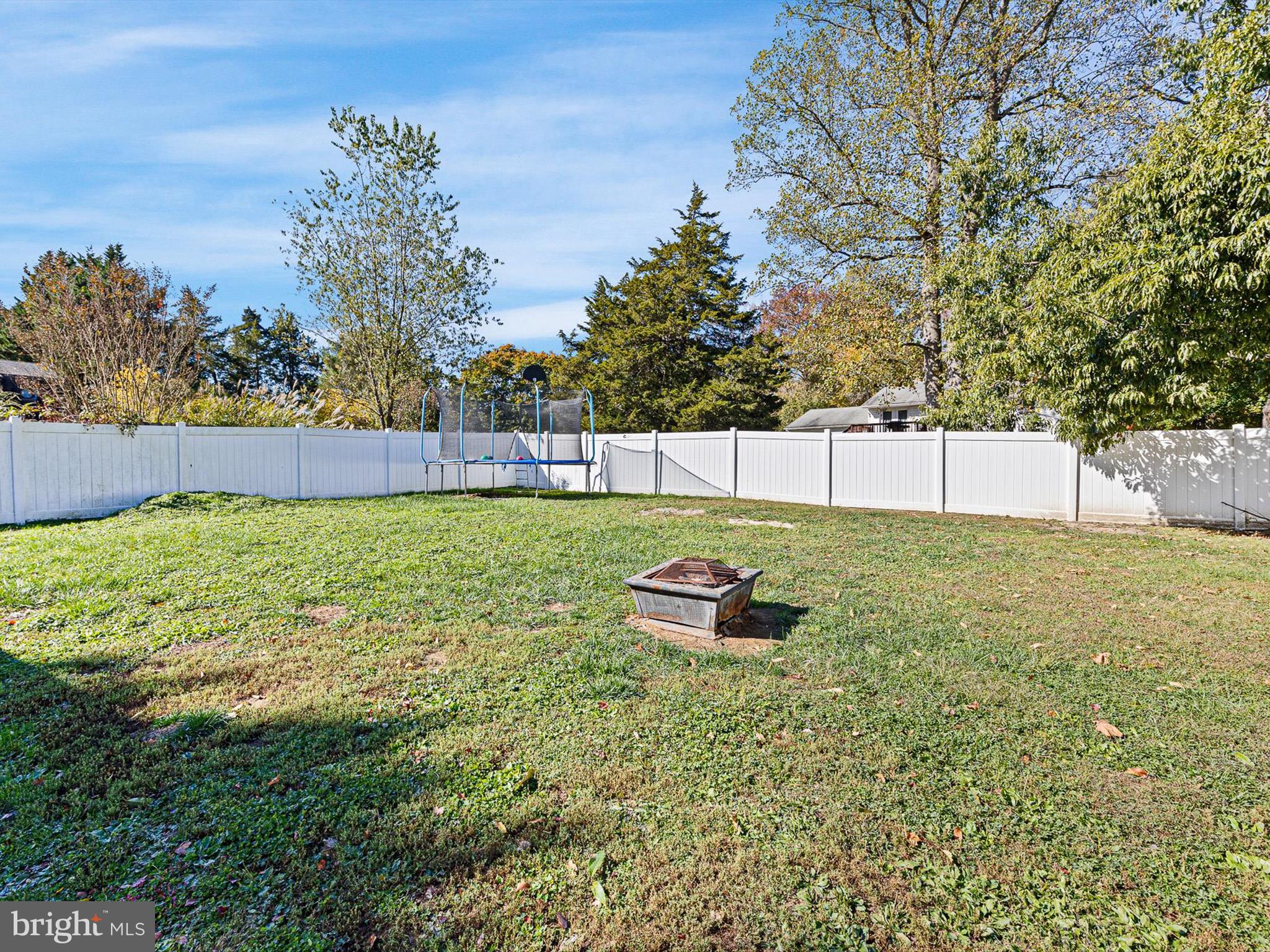 653 Mechanics Valley Road North East, MD 21901 - Photo 4 of 21 a view of a backyard with a bench and trees