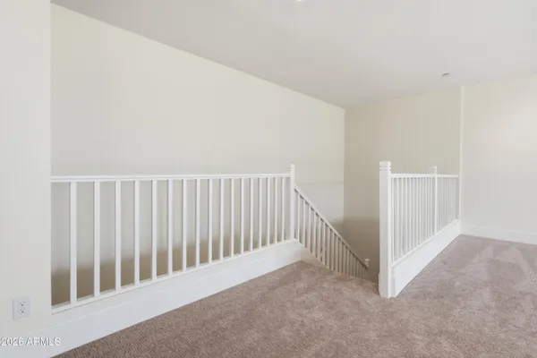 an empty room with an entrance to other room