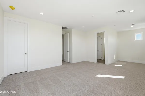 a spacious bathroom with a double vanity sink mirror and bathtub