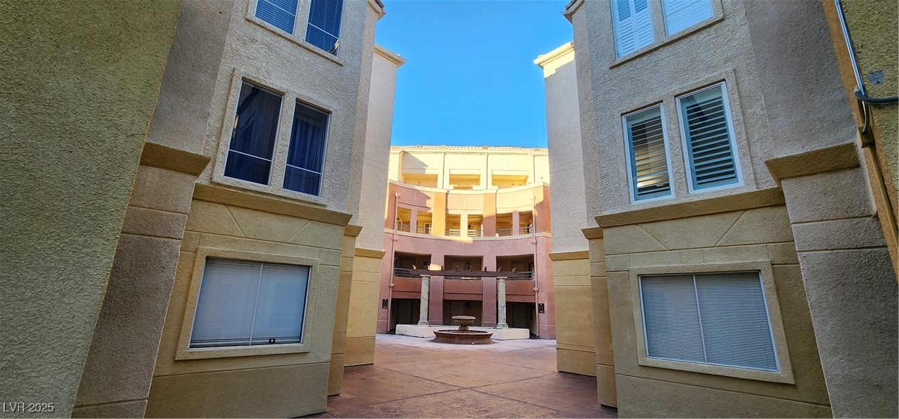 210 East Flamingo Road, Unit 326 Las Vegas, NV 89169 - Photo 30 of 58 Walkway to subject unit. Pool is directly behind.