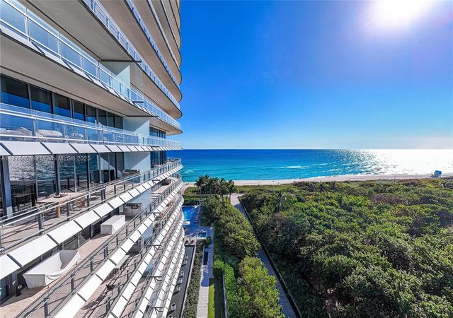 a view of a balcony with an ocean view