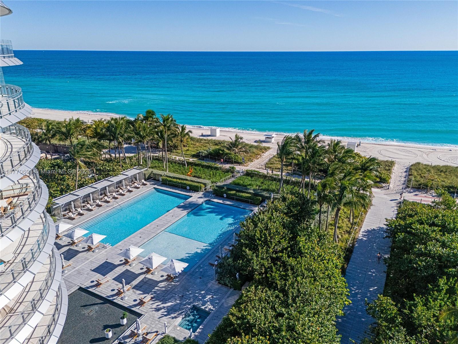 8701 Collins Avenue, Unit 804 Miami Beach, FL 33154 - Photo 8 of 25 a view of a yard with an ocean view