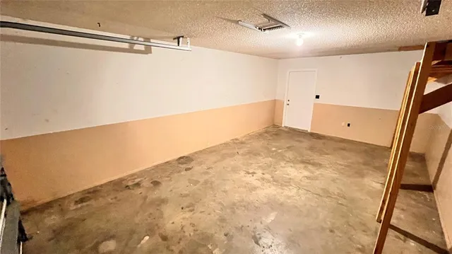 a view of a house with a tree in the background