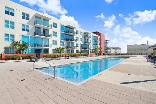 a view of a swimming pool with a lounge chairs