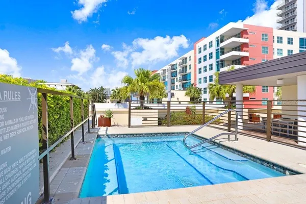 a view of a swimming pool with a patio
