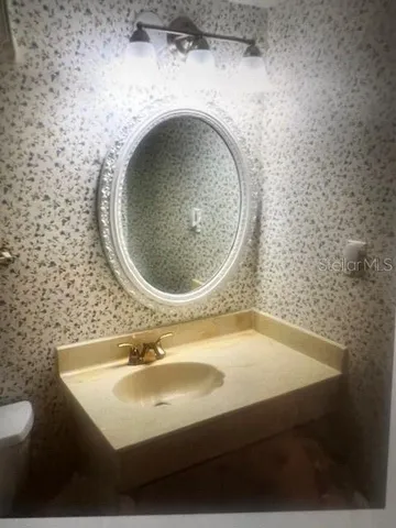 a bathroom with a bathtub and toilet