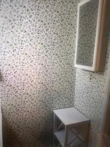 a bathroom with a sink and toilet