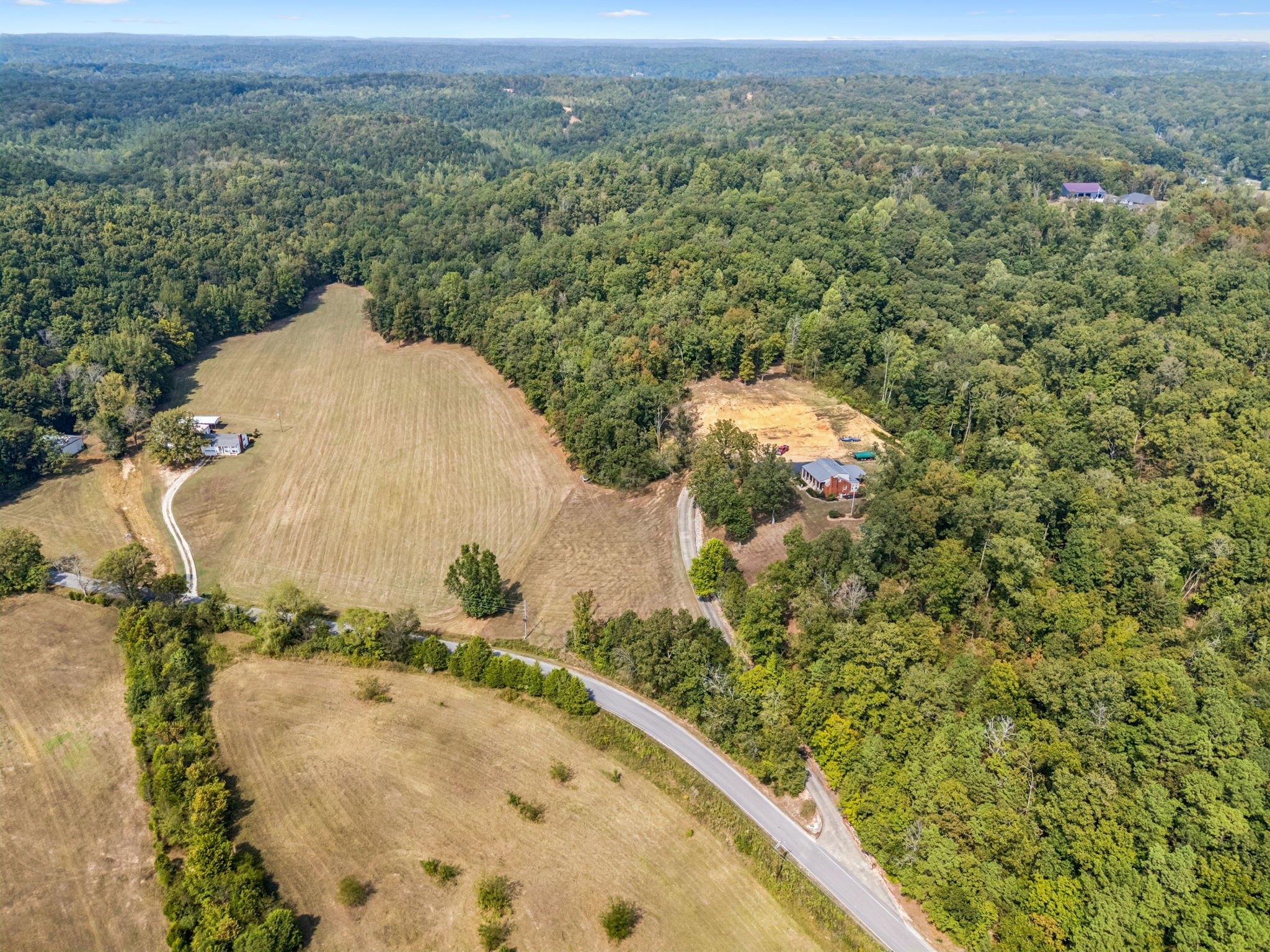 2151 Bakerville Road Waverly, TN 37185 - Photo 12 of 67 an aerial view of a house with a yard and lake view