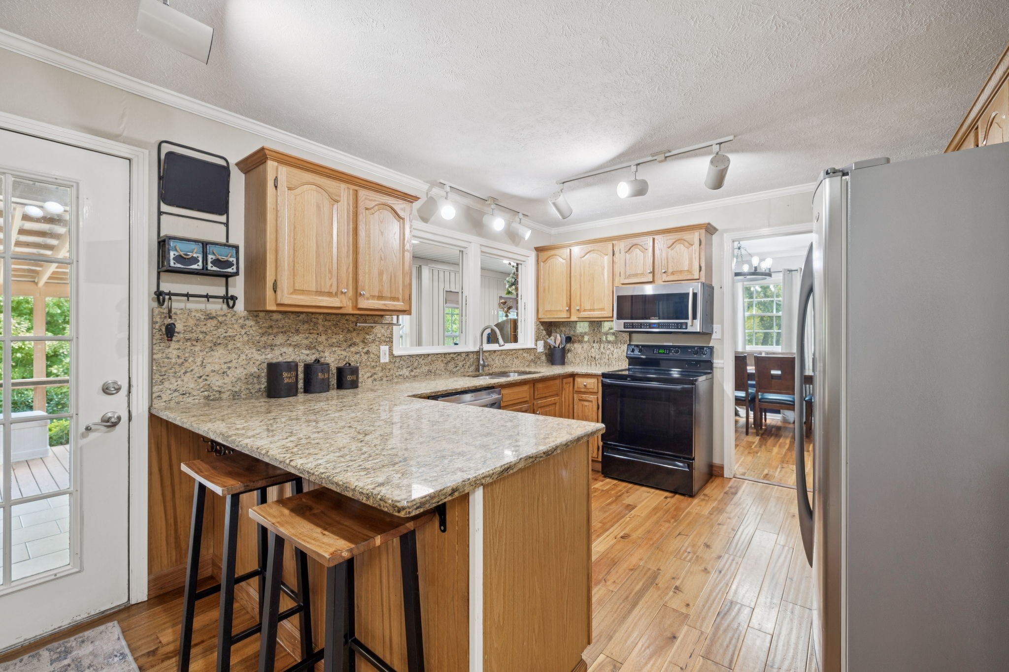 2151 Bakerville Road Waverly, TN 37185 - Photo 21 of 67 a kitchen with a stove a sink and a refrigerator
